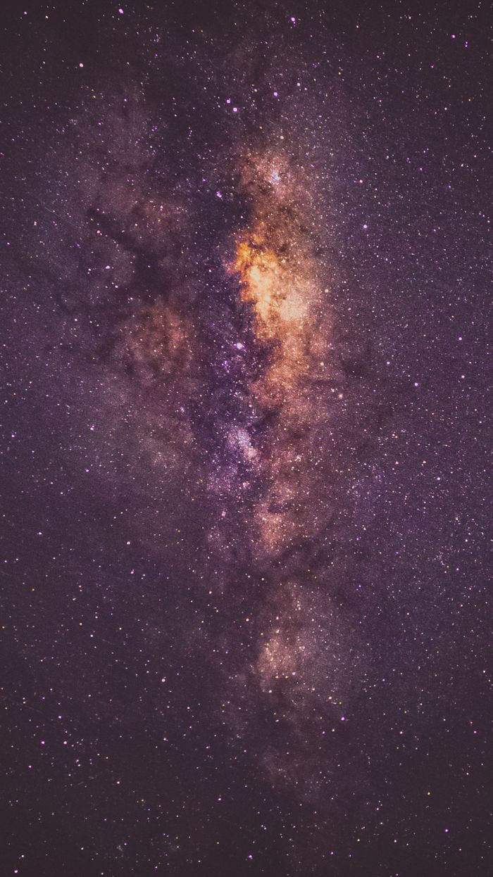 Capture the beauty of the Milky Way galaxy in a breathtaking vertical night sky shot.